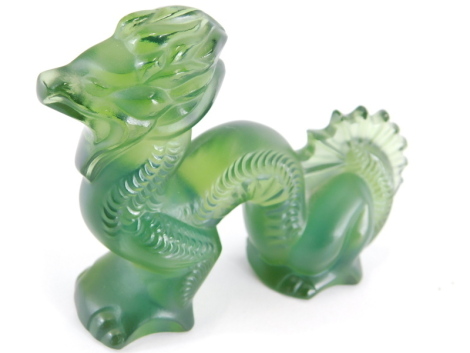 A 20thC Lalique green glass figure of a dragon, signed, 9cm wide.