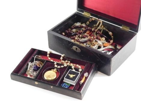 A good selection of costume and other jewellery, a chased gold plated fob watch, 3cm diameter, pearl finished necklace, amethyst coloured pendant, other good costume jewellery and effects, beads, necklaces, polished club and bead necklace, etc., contained