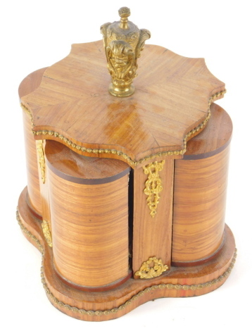 A 19thC French kingwood perfume box, with articulated sections revealing gilt highlighted glass bottles, with shaped knop and gilt metal embellishments, 22cm high.