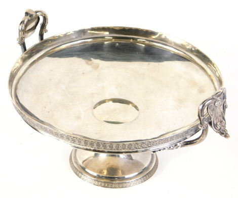 A 19thC Tiffany & Co tazza, with shaped scroll handles, raised floral rim, inverted stem and circular foot, white metal numbered 2042 3936, quality 925/1000, Tiffany and Co, white metal, circa 1870, 30cm high.