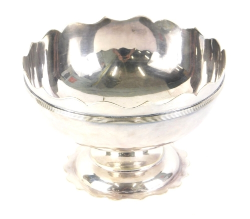 A Continental Montieth bowl, with shaped rim, compressed stem and shaped foot, white metal, impressed f, 20cm wide,