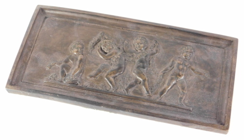 A 20thC rectangular plaque, raised with cherubs, 13cm x 28cm.