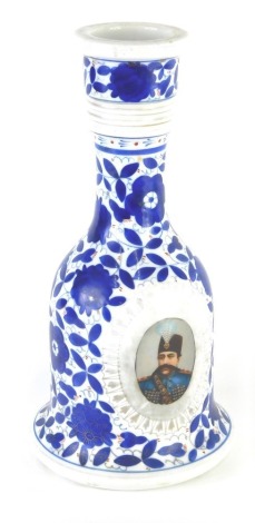 A 19thC pottery decanter, of mallet shape set with a profile of a gentleman with a blue floral background, unmarked, 27cm high.