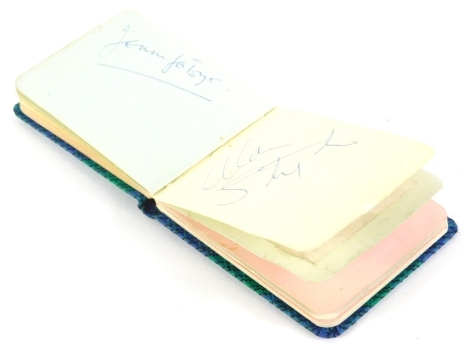 An autograph book, containing various signatures to include John Neville, Sir Cliff Richard, various show jumpers from the 1960's, David Broome, Pat Smythe, Harvey Smith, and others, D'Oyly Carte Opera Company 1960's soloists from Gilbert and Sullivan Ope