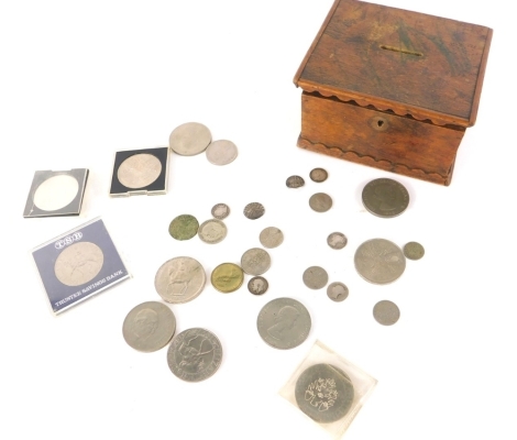 A treen money box, 13cm wide, containing a quantity of various crowns, commemorative and others, six pences, silver and other coins, etc. (a quantity)