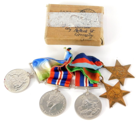 A mixed World War II medal group, comprising 1939-45 star, another, Defence medal and two Victory medals, in outer box.