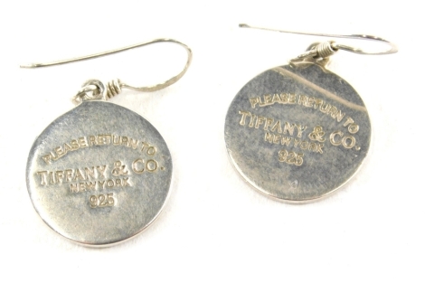 A pair of Tiffany & Co drop earrings, with plain circular discs marked New York 925, 2cm diameter. (2)