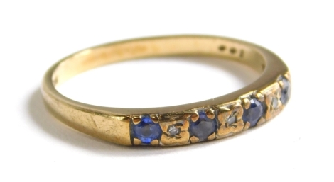 A 9ct gold dress ring, set with blue and white stones.