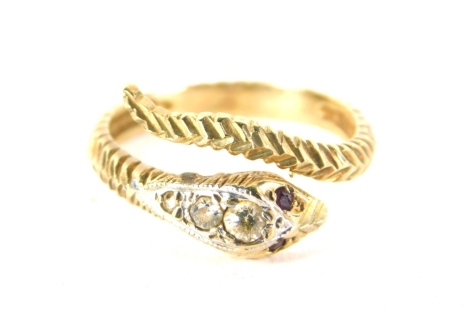 A serpent ring, the eyes picked out with garnets, the head in white stones, unmarked.