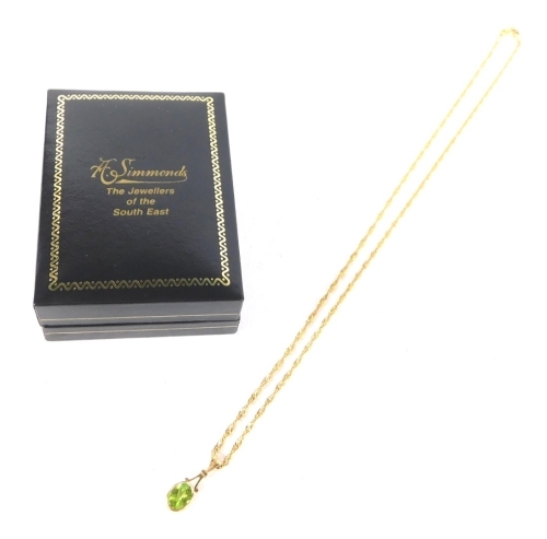 An Edwardian drop pendant, set with oval green stones, attached to a slender link necklace, 9k, 42cm long, 3g all in.