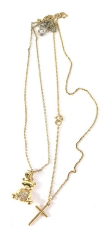 A 9ct gold cross, attached to a slender link necklace and a further teddy bear pendant, with necklace. (2)