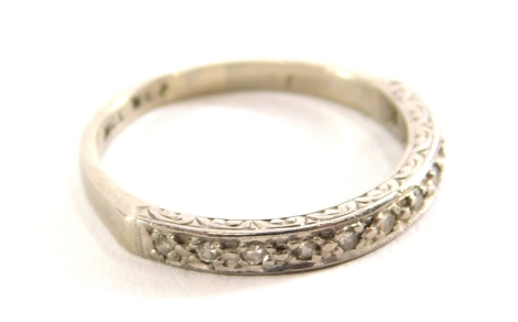 A white gold half eternity ring, set with small white stones, marked 18ct, 3g all in.