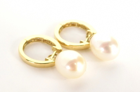 A pair of cultured pearl and diamond hoop earrings, each hoop set with ten round brilliant cut tiny diamonds and a single cultured pearl loop, in yellow metal stamped 14k, 2.5cm high, 5.6g all in.