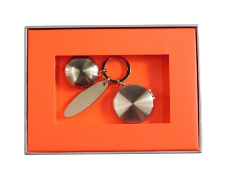 A Vodafone McLaren Mercedes keyring vanity case and fob set, partially boxed.