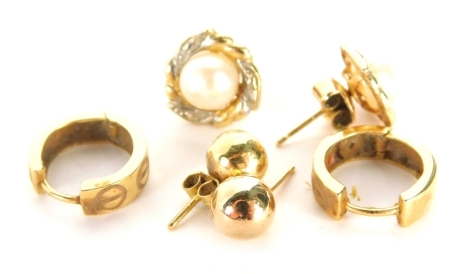 Three pairs of 9ct gold earrings, comprising a pair of hoop earrings, each with circle cross hatch design, 1cm high, a pair of bicolour cultured pearl set studs and a pair of plain 9ct gold studs, 5.6g all in.