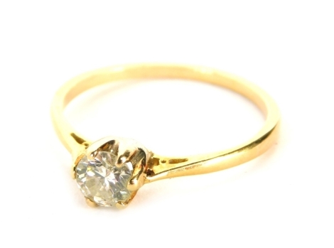 A diamond solitaire ring, with round brilliant cut diamond in six claw setting, measuring approximately 0.25ct overall, with pierced design shoulders on a yellow metal band unmarked believed to be 18ct gold, ring size N½, 1.8g all in.