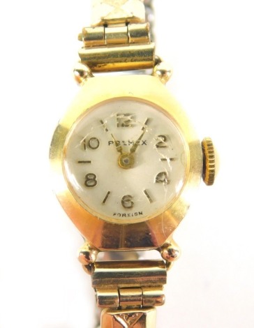 A Primax ladies wristwatch, the small circular watch head with numeric dial, in a gold plated and stainless steel backed case, on an expanding gold plated bracelet.