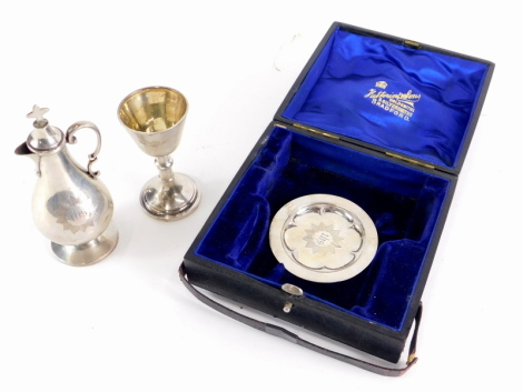 An Edward VII silver travelling communion set, comprising miniature chalice, tray, and offertory jug, in fitted case, Birmingham 1902, 3½oz weighable silver. (cased)