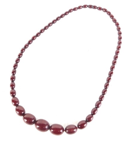 A graduated cherry amber style necklace, 66cm long.