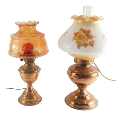 A 20thC Duplex oil lamp, with amber coloured glass shade and electrical feature 39cm high and another similar. (2) Buyer Note: WARNING! This lot contains untested or unsafe electrical items. It is supplied for scrap or reconditioning only. TRADE ONLY