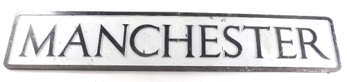 A 20thC metal City of Manchester sign, in black and white, 100cm wide.