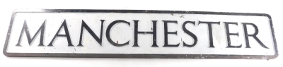 A 20thC metal City of Manchester sign, in black and white, 100cm wide.