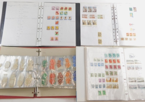 Various world used stamps, early 20thC New Zealand, pink back, blue back, geography and the national curriculum folder containing various other stamps, Australia, mid 20thC and later, Commonwealth and world use stamps, collectable stamps part used sets. (