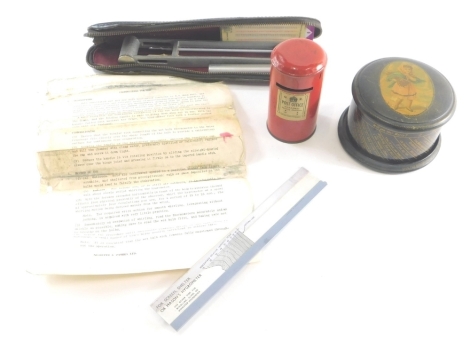 A late 19thC Clark & Co black lacquered cotton reel box, on rotating stand, decorated with a figure of a child to the lid, with inner label, 11cm diameter, a G R tin plate Post Office Bank, and a Negretti & Zambra pocket whirling hygrometer. (3)