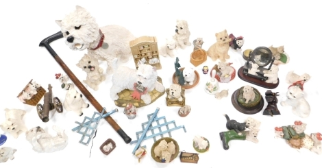 Various West Highland Terrier dog ornaments, to include a fireside star model, 34cm high, and various others, table cannon, turned walking stick, etc. (a quantity)