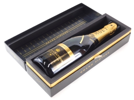 A bottle of Moet & Chandon Grand Vintage 2003, boxed.