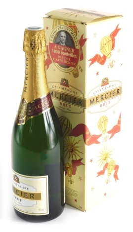 A bottle of Mercier brut champagne, boxed.