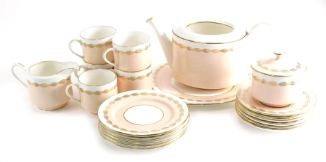 A 20thC Aynsley part tea service, to include teapot, 13cm high, cups, saucers, side plates, etc, decorated in peach and white with gilt highlights, printed marks beneath. (a quantity)