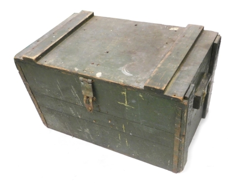 A 20thC wooden ammunition case, pained in green, 37cm high, 66cm wide, 40cm deep.