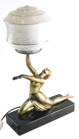 An Art Deco style table lamp, formed as a nude lady holding speckled glass shade with gilt highlights and a black marble finish base with electrical feature, unsigned, 53cm high.