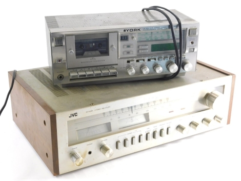 A JVC JR-S8IM Stereo Receiver, 15cm high, 51cm wide, 32cm deep and a York model SCR827 compact system. (2) Buyer Note: WARNING! This lot contains untested or unsafe electrical items. It is supplied for scrap or reconditioning only. TRADE ONLY