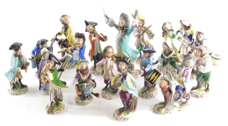 A 20thC Volkstedt porcelain factory monkey band to include conductor 16cm high and other matched pieces, piano player, bagpipe player, various others, printed marks beneath. (19)