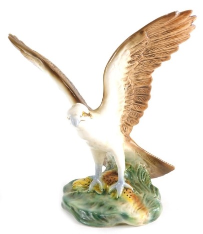 A 20thC Sylvac pottery figure of a falcon, wings outstretched, printed marks beneath, 23cm high.