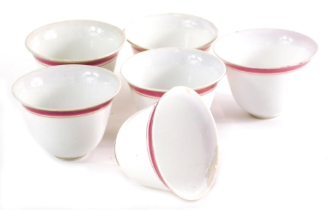 A set of six Russian porcelain tea bowls, sparsely decorated with brown banding, 6cm diameter. (6)