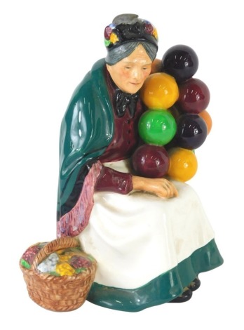 A Royal Doulton figure The Old Balloon Seller, HN1315, printed marks beneath, 18cm high.