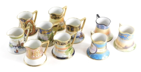 Various 20thC Noritake porcelain jugs, to include one decorated with scenery, with gilt highlights 8cm etc. (a quantity)