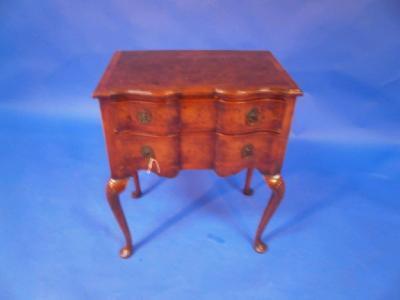 An early 20thC walnut veneered lowboy in the late 17thC style