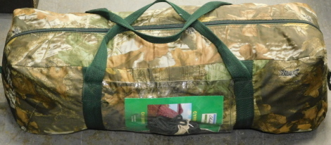 A camouflage carp fishing bivvy, with carry bag.