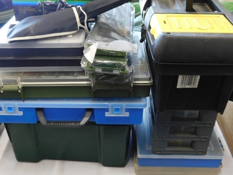 Fishing tackle boxes and various associated items, including rig cases, fishing floats, lures, etc.