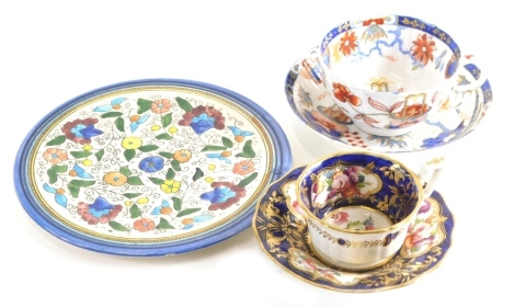 A Coalport type porcelain cup and saucer, painted with flowers, an Imari pattern cup and saucer, etc. (AF)