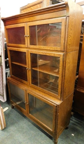 An oak Globe Wernicke type bookcase, with three pairs of glazed hinged doors, 89cm wide.