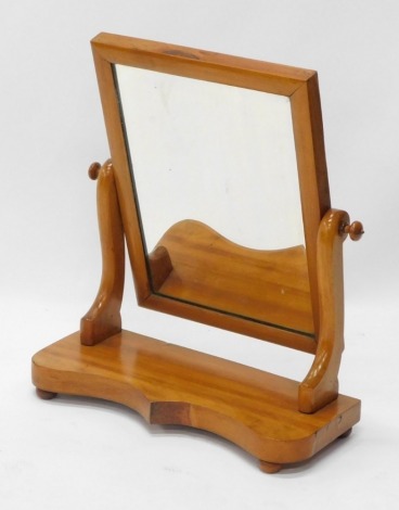 A Victorian satin walnut dressing table mirror, with shaped base, 47cm wide.