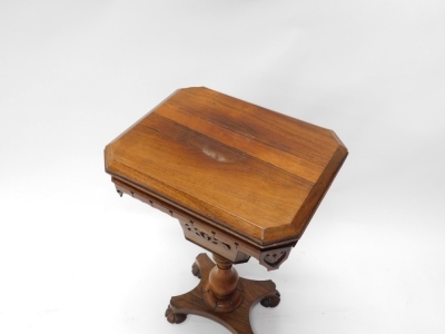 A William IV rosewood worktable, the canted rectangular top hinged to enclose a fitted interior and a wool bag, on a turned column with concave platform, with lobed bun feet, 74cm high, 48cm wide. - 2