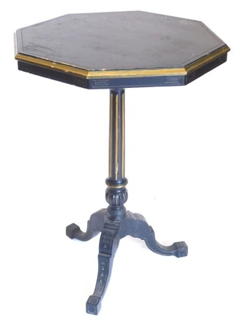 A Victorian ebonised and parcel gilt occasional table, the octagonal top on a part fluted turned column and tripod base, 70cm high, 50cm wide.