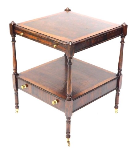 A rosewood and mahogany two-tier what not, with a brushing slide and a drawer on turned supports with brass castors, 46cm wide.