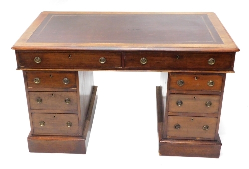 A late Victorian mahogany pedestal desk, the top with a brown leatherette insert above two frieze drawers and three drawers to each pedestal on a plinth, 72cm high x 121cm wide.